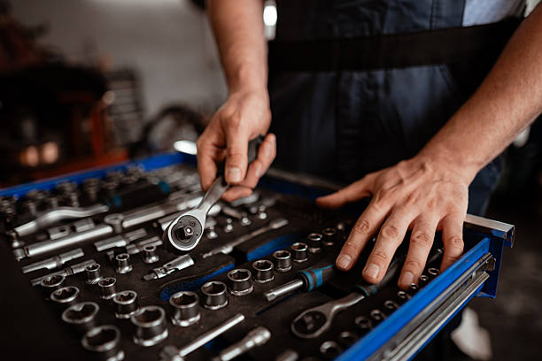 istock Mechanic organized tools in workshop preparing for vehicle repair work 2246078934