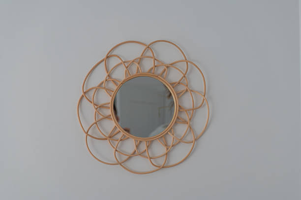istock Rattan sunburst wall mirror in a bright modern Gdansk apartment 2246081788
