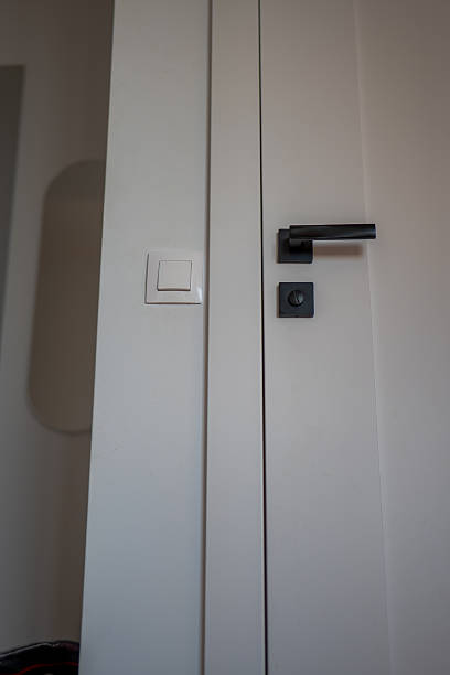 istock Minimalist door handle and switch in bright modern Gdansk apartment 2246081799