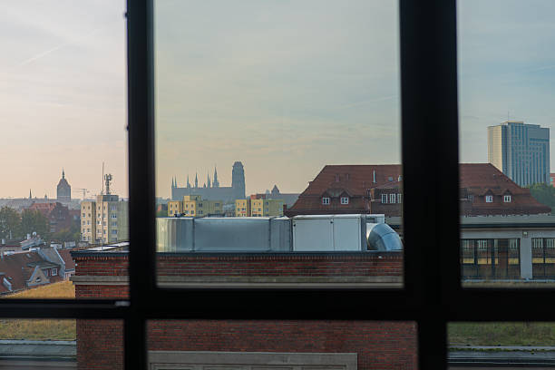istock Gdansk dusk cityscape through window grid with St Marys tower 2246081849