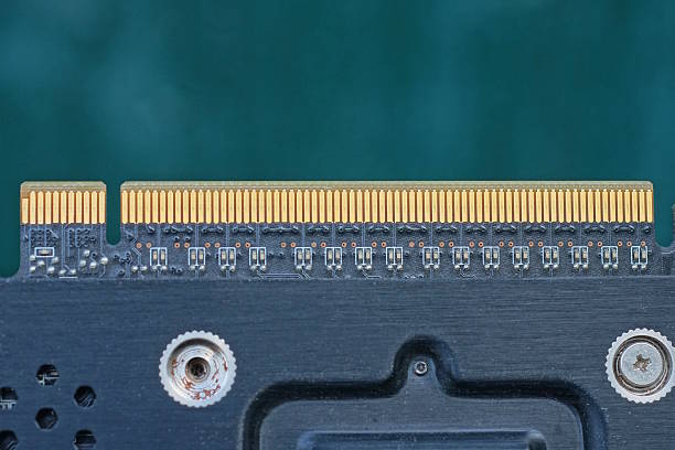 part of one black yellow microcircuit on a video card on a green background