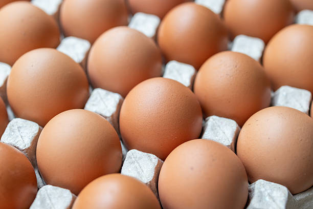 istock Fresh organic brown chicken eggs in cardboard tray 2246084854