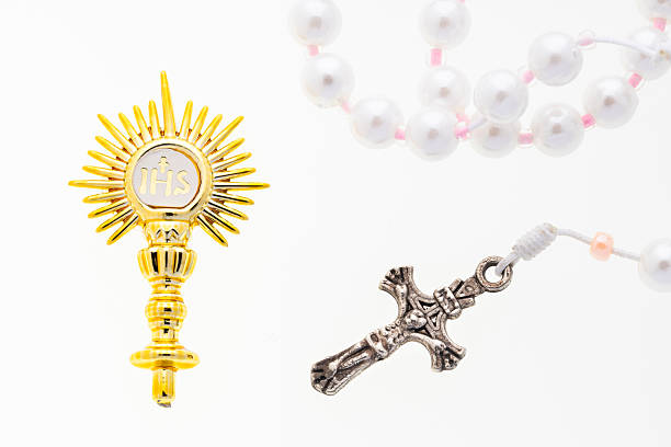 Golden brooch, Golden religious symbol with IHS monogram and Catholic rosary
