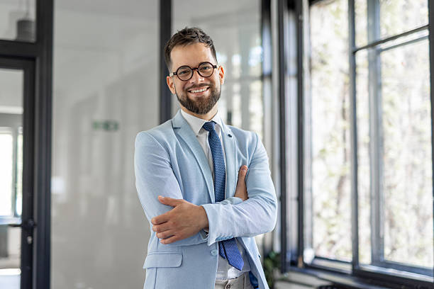istock Smiling Professional Man in Light Blue Suit in Office 2246086685