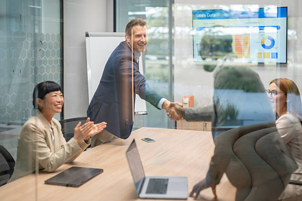 istock Business team celebrating successful agreement in modern office 2246086720
