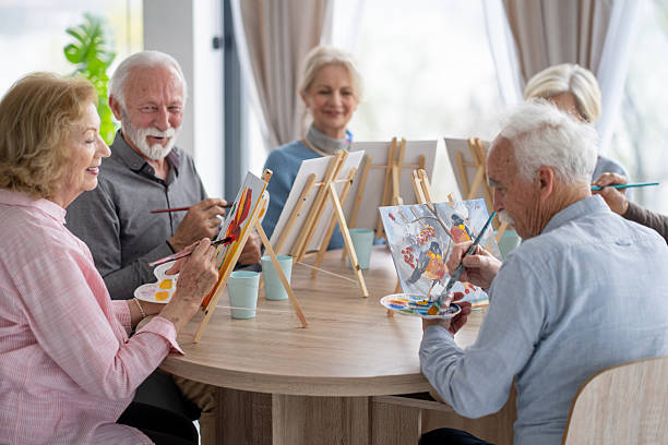 istock Seniors painting colorful masterpieces in a group 2246086948