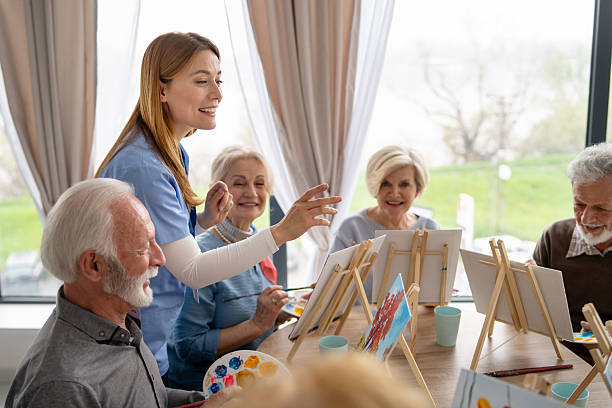 istock Elderly artists gather for a joyful painting session 2246086952