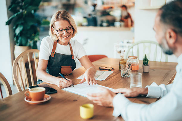 istock Small business owner discussing financing options with loan agent 2246087070