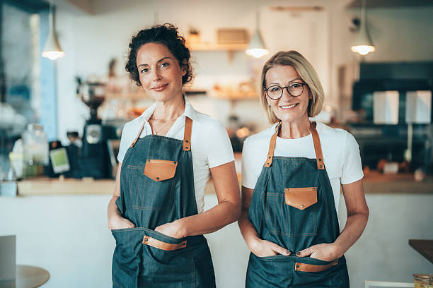 istock Confident coffee shop and bakery owners standing together 2246087084