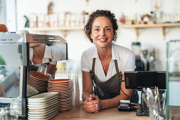 istock Confident barista owner ready to serve with a smile 2246087092