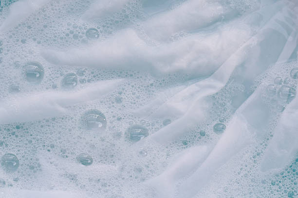 istock White cloth soaked in powder detergent water dissolution, washing cloth. Laundry concept 2246087294