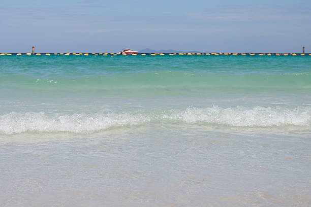 Beautiful sandy Ko Phangan beach on the Andaman sea in Thailand.