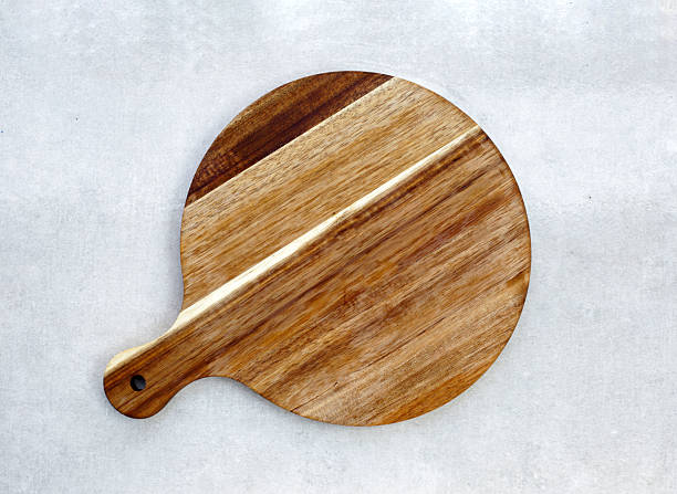 istock Wooden cutting board on grey background. 2246087713