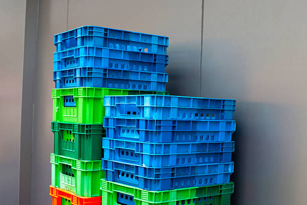 istock Stacked colorful plastic crates against a gray wall 2246088407