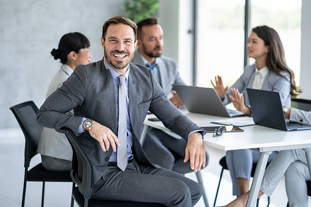 istock Smart and Smiling Business Professional in Modern Office 2246091158
