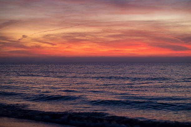 istock Sunrise background. Dramatic majestic scenery sunset. Sky with clouds in Sunrise sky light background. Sunrise with clouds in various shapes. Calm Sunrise sky and sun through clouds over. 2246091204