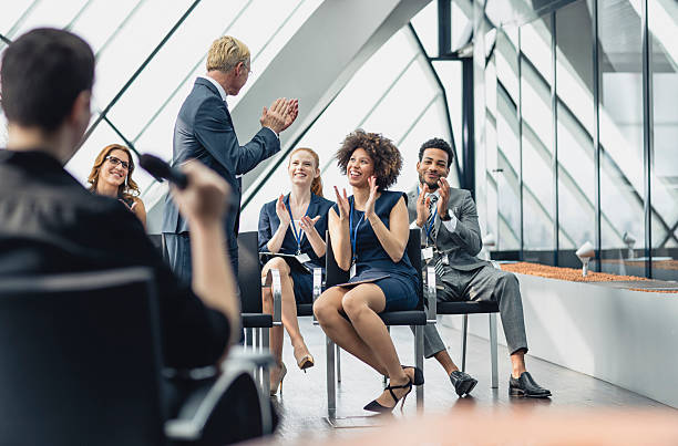istock Enthusiastic Business Executives Applauding Speaker During Engaging Conference Session 2246091435
