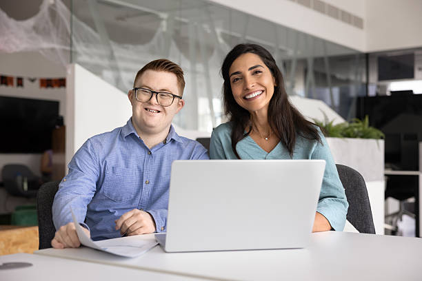 istock Two happy diverse professional colleagues working for inclusive company 2246093823