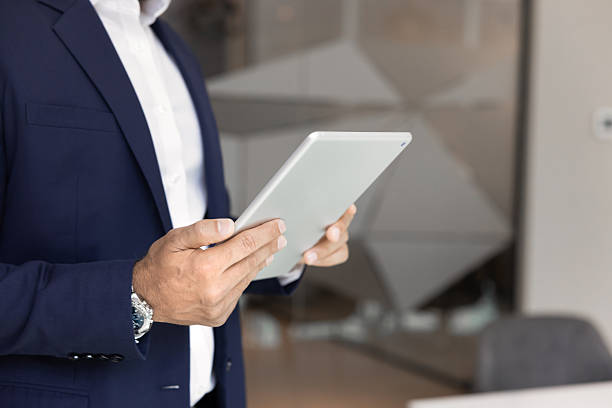 istock Hands of businessman using online product, digital device 2246094859