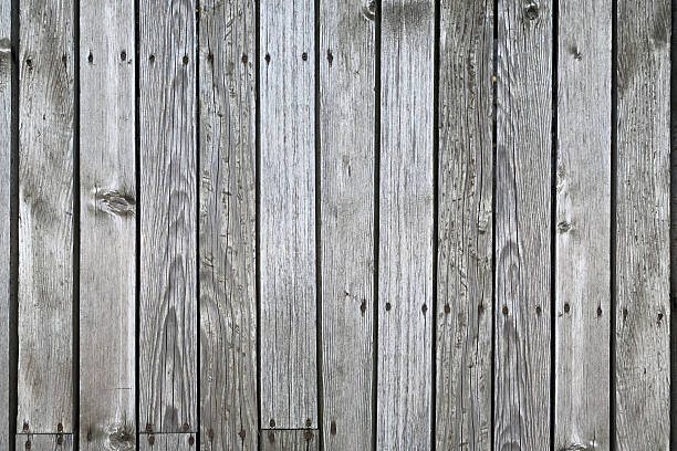 istock Weathered Vertical Wood Plank Wall with Gray and Brown Tones 2246095614