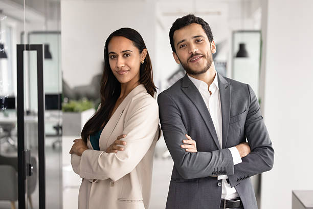 istock Two diverse young business partners posing for corporate portrait 2246095701