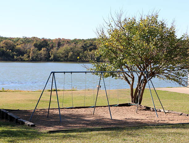 istock Swings Set at the Lake 2246096940