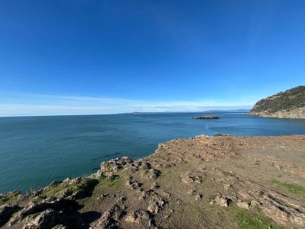 istock Beautiful coastal view with rocky cliffs and calm blue waters on a clear sunny day 2246100239