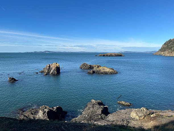 istock Beautiful coastal view with rocky cliffs and calm blue waters on a clear sunny day 2246100306