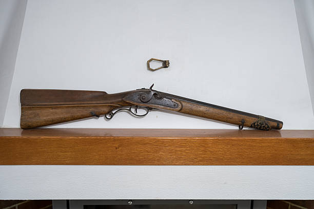 istock ntique black powder, muzzle-loading percussion cap rifle or shotgun, likely dating from the 19th century 2246100788