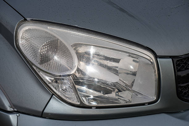 istock shiny headlights on a new car 2246103090
