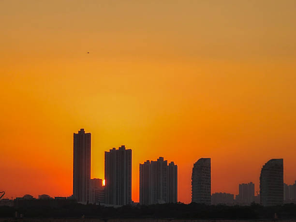 The urban skyline bathed in orange glow