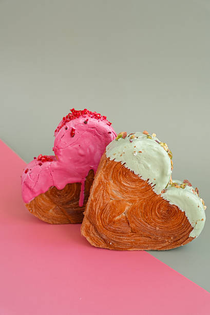istock Valentine's Day Birthday holiday present gift idea Coffee cappuccino latte beverage drink Morning breakfast Holiday birthday anniversary shiny candle sparkler on cake Delightful and vibrant heartshaped pastry croissant treat, beautifully topped with 2246103807