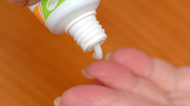 istock Cream being applied on a hand to soothe dry skin in a cozy setting 2246112697