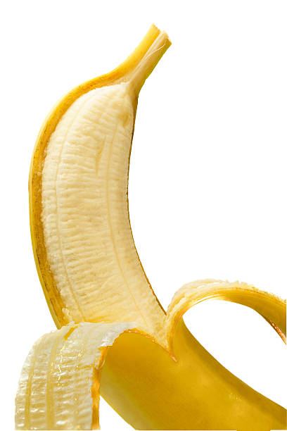 istock Peeled banana revealing yellow fruit against white background 2246120076