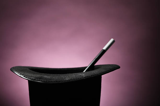istock Magician's hat and wand on dark background 2246120442