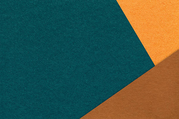 istock Abstract dark teal, orange and brown paper background with copy space. Template for presentation, banner, card design 2246120799