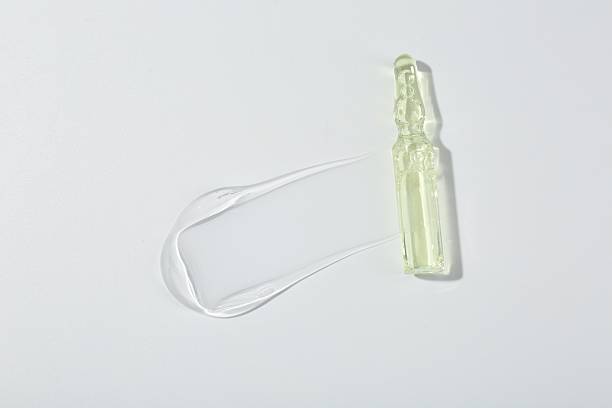 istock Skincare ampoule on white surface with gel, top view 2246120931