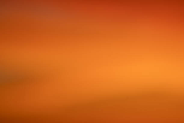 istock Abstract orange and warm yellow gradient creating a soft, blurred background with smooth color transitions, providing a calm backdrop for various design uses 2246121140
