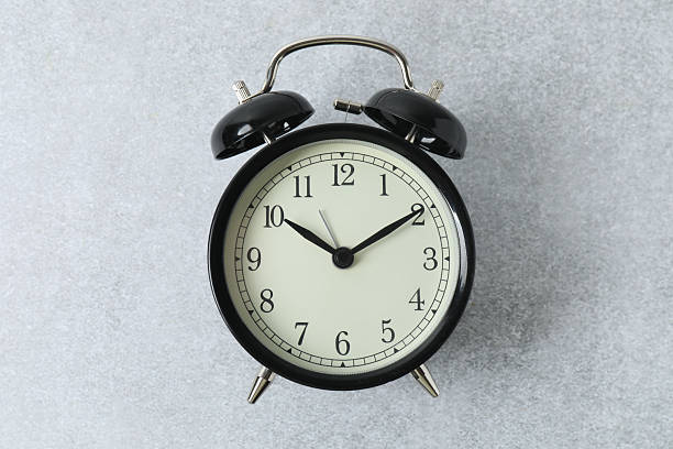 istock black alarm clock on backgrounds with space for text 2246122251