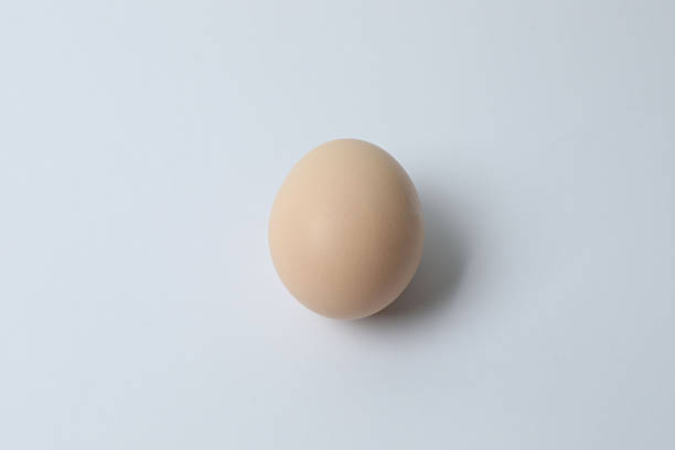 istock Chicken eggs in a basket, isolated on a white background 2246122384
