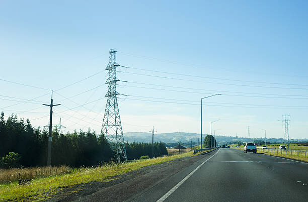 istock Power pylon and power lines along motorway. State Highway 1 (SH1). Auckland. 2246123343