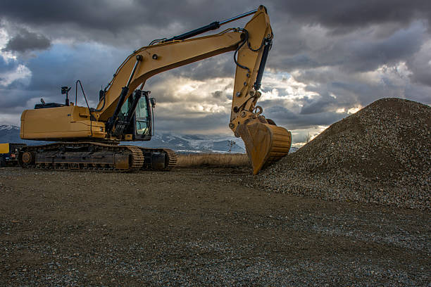 Excavator at the end of a working day at a construction site in a beautiful evening
