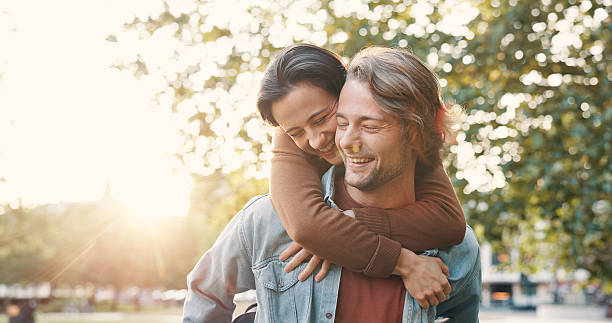 istock Love, piggyback and date with couple in park for romance, honeymoon getaway and commitment. Support, bonding and connection with man and woman outdoor for anniversary, trust and relationship together 2246128444