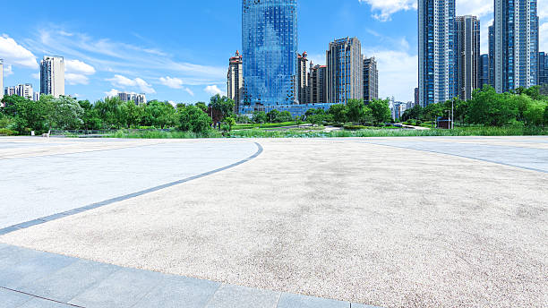 istock Empty square floor with modern urban skyline and sunny blue sky background 2246130247
