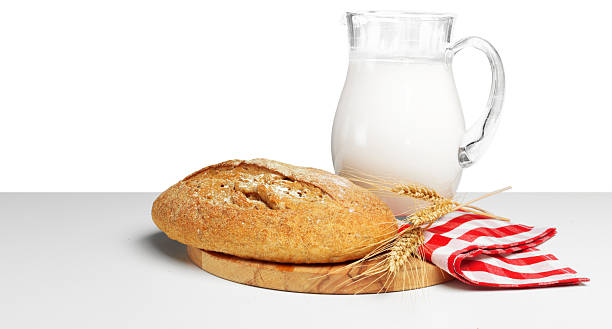 istock Freshly baked bread and milk create a cozy meal setting in a simple kitchen 2246130419