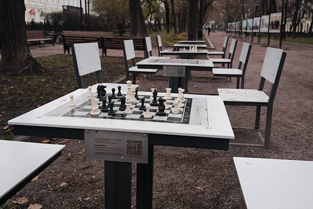 Chess tables in Moscow park, city park, leisure time activity for city residents, park view in autumn season