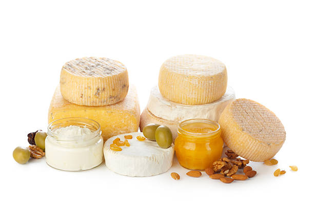 Cheese varieties with spreads, nuts, and olives arranged neatly for a gourmet tasting experience.