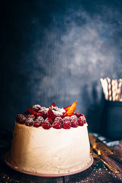 Cream cake with red berries and strawberries