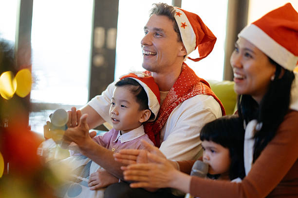 istock Family Singing Karaoke Together During Christmas Celebration 2246133772