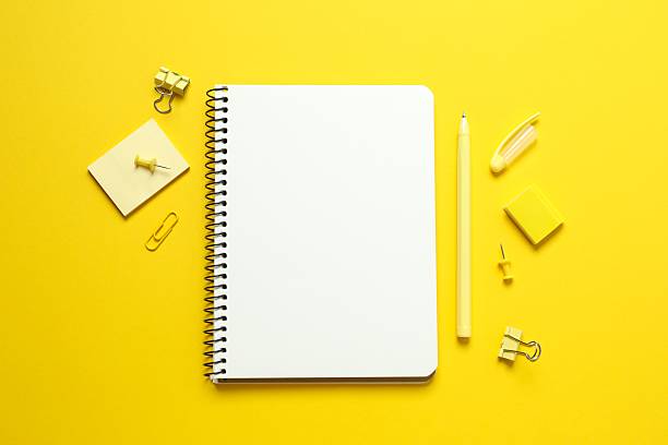 istock Empty notebook with stationery on color background, top view 2246134829